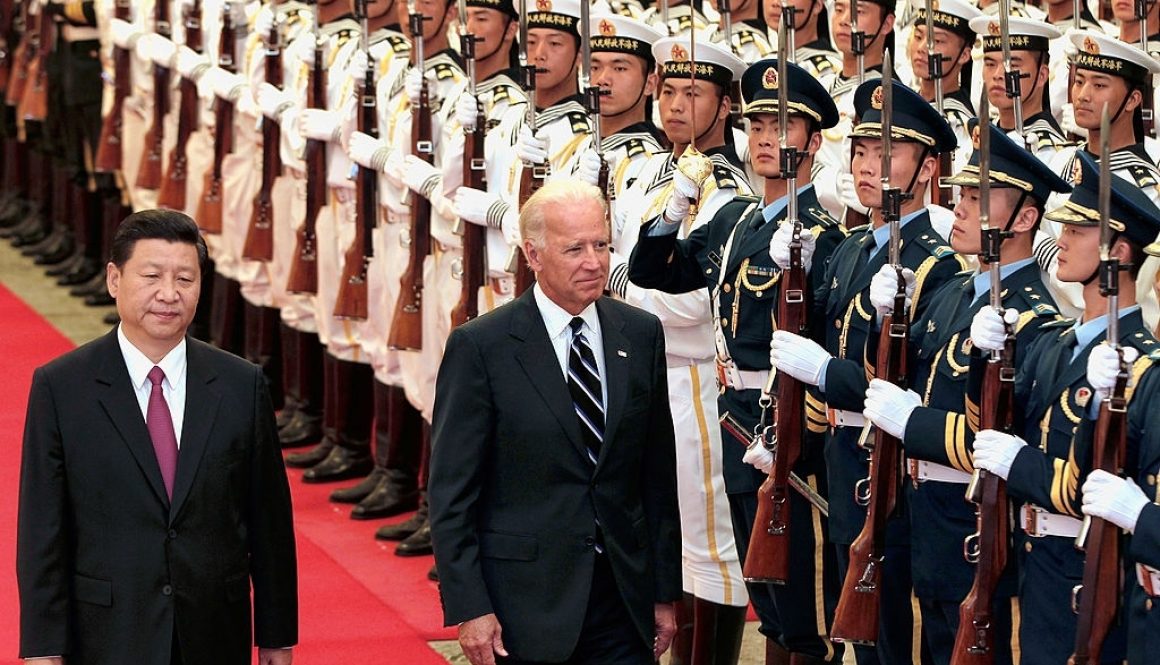 BEIJING, CHINA - AUGUST 18: Chinese Vice President Xi Jinping accompanies U.S. Vice President Joe Biden (R) to view an honour guard during a welcoming ceremony inside the Great Hall of the People on August 18, 2011 in Beijing, China. Biden will visit China, Mongolia and Japan from August 17-25. (Photo by Lintao Zhang/Getty Images)