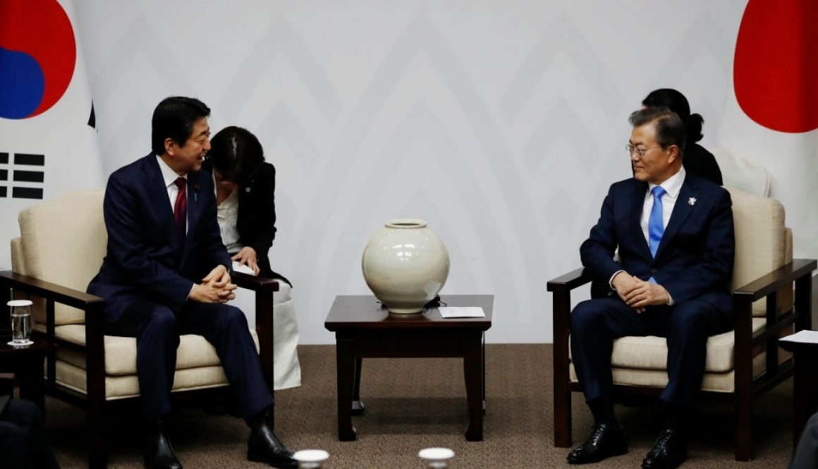 South Korea's President Moon Jae-in (R) talks with Japan's Prime Minister Shinzo Abe (L) during their meeting in Pyeongchang on February 9, 2018, ahead of the opening ceremony for the Pyeongchang 2018 Winter Olympic Games. / AFP PHOTO / POOL / KIM HONG-JI (Photo credit should read KIM HONG-JI/AFP via Getty Images)