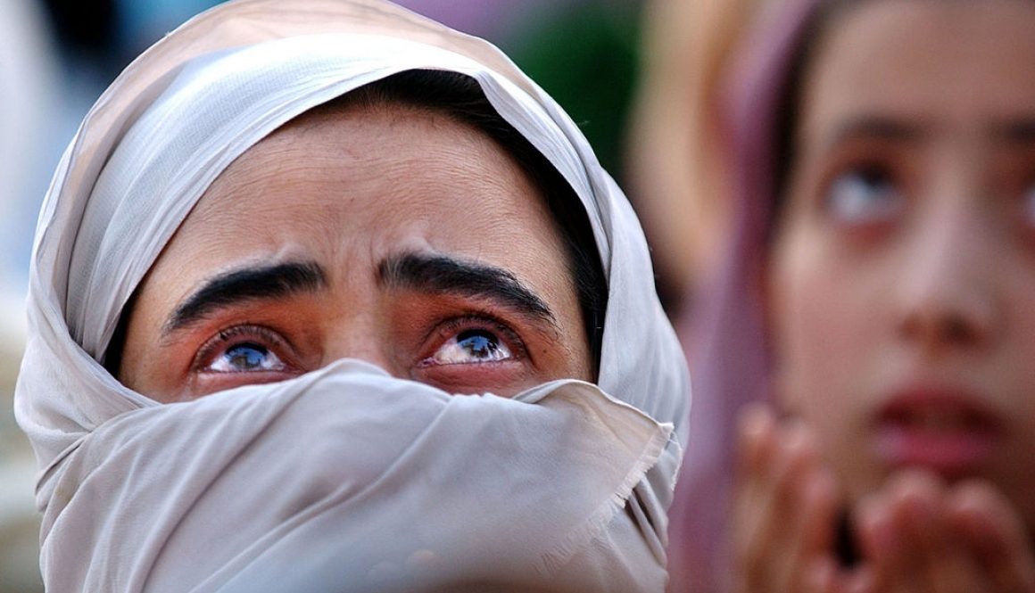 405833 03: A Kashmiri women cries as she looks up at what is believed to be a relic of the Prophet Mohammad's hair May 25, 2002 at the Hazratbal Shrine in Srinagar, India. Thousands of Muslims in Kashmir celebrate the Prophet's birthday by going to shrine to pray. Tensions have been higher in the disputed region of Kashmir after Pakistan tested a surface-to-surface missile on May 25, 2002. (Photo by Ami Vitale/Getty Images)
