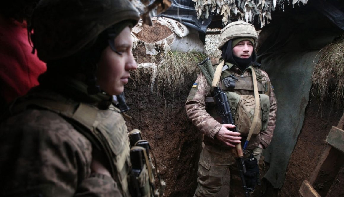 Ukrainian servicemen wait in a trench on their position on the front line with Russia-backed separatists near the small town of Svitlodarsk, in Donetsk region on December 18, 2021. (Photo by Anatolii STEPANOV / AFP) (Photo by ANATOLII STEPANOV/AFP via Getty Images)