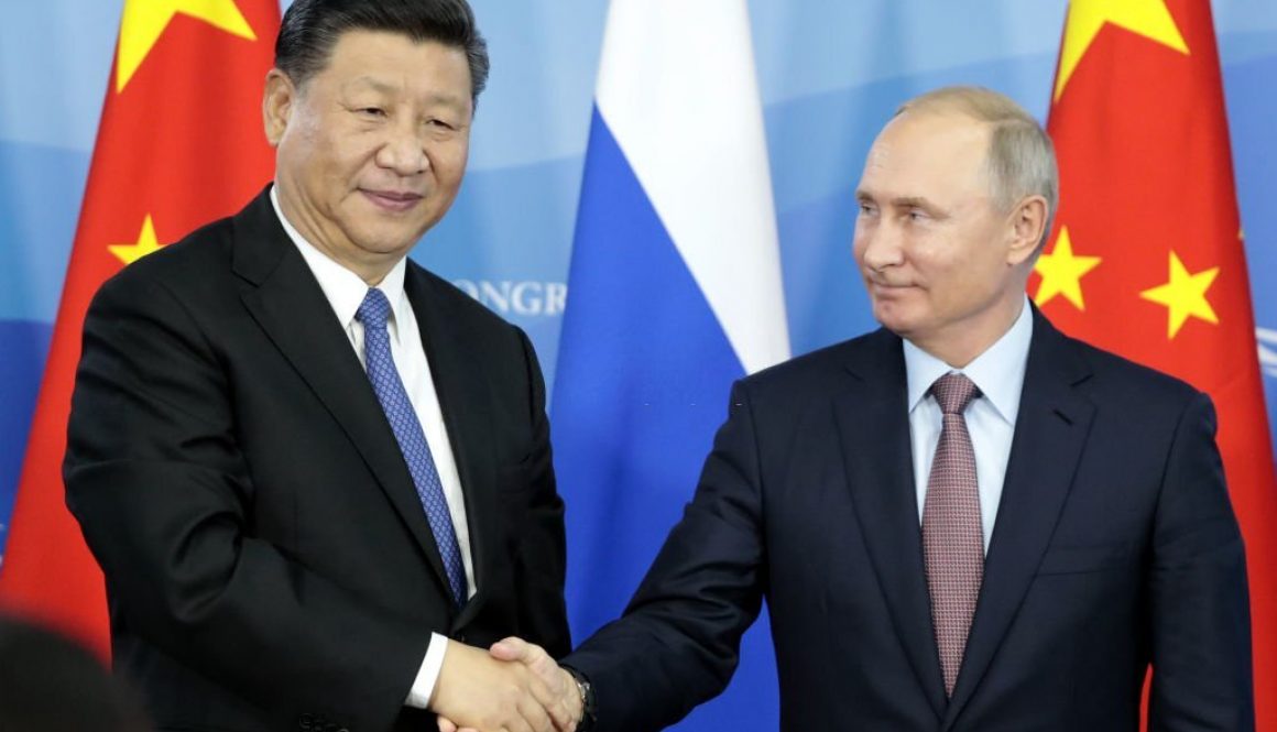Russia's President Vladimir Putin (R) shakes hands with his China's counterpart Xi Jinping during a signing ceremony following the Russian-Chinese talks on the sidelines of the Eastern Economic Forum in Vladivostok on September 11, 2018. (Photo by SERGEI CHIRIKOV / POOL / AFP) (Photo credit should read SERGEI CHIRIKOV/AFP via Getty Images)