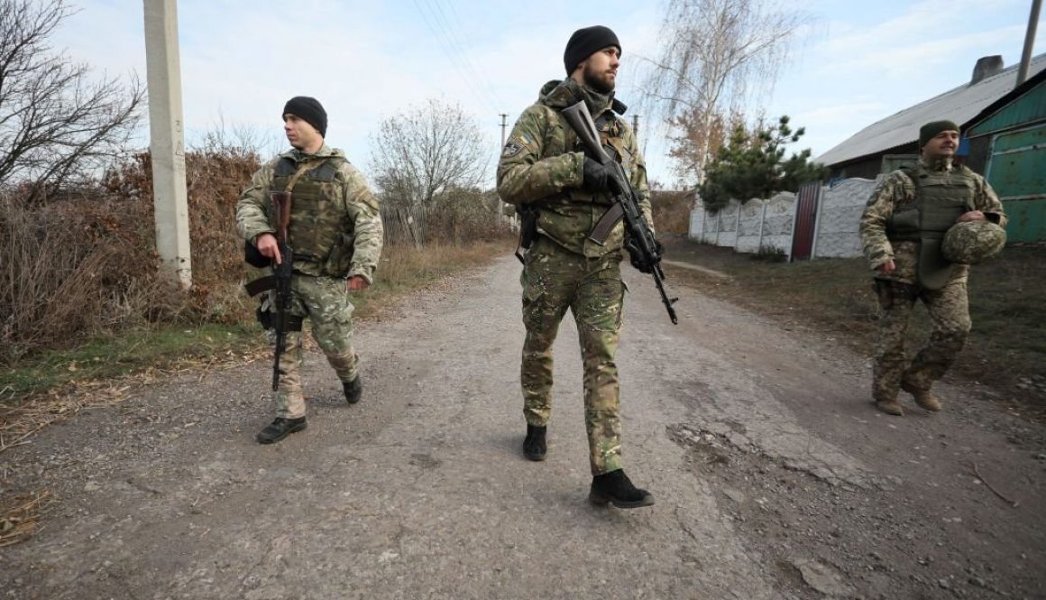 Ukrainian servicemen patrol in the streets of the village of Katerynivka, in the Lugansk region on November 2, 2019, after their withdrawal. - Ukrainian army and Moscow-backed separatists said on October 29, 2019 they had begun to withdraw their troops from a key area in the war-torn east ahead of a high-stakes summit with Russia. (Photo by Aleksey Filippov / AFP) (Photo by ALEKSEY FILIPPOV/AFP via Getty Images)