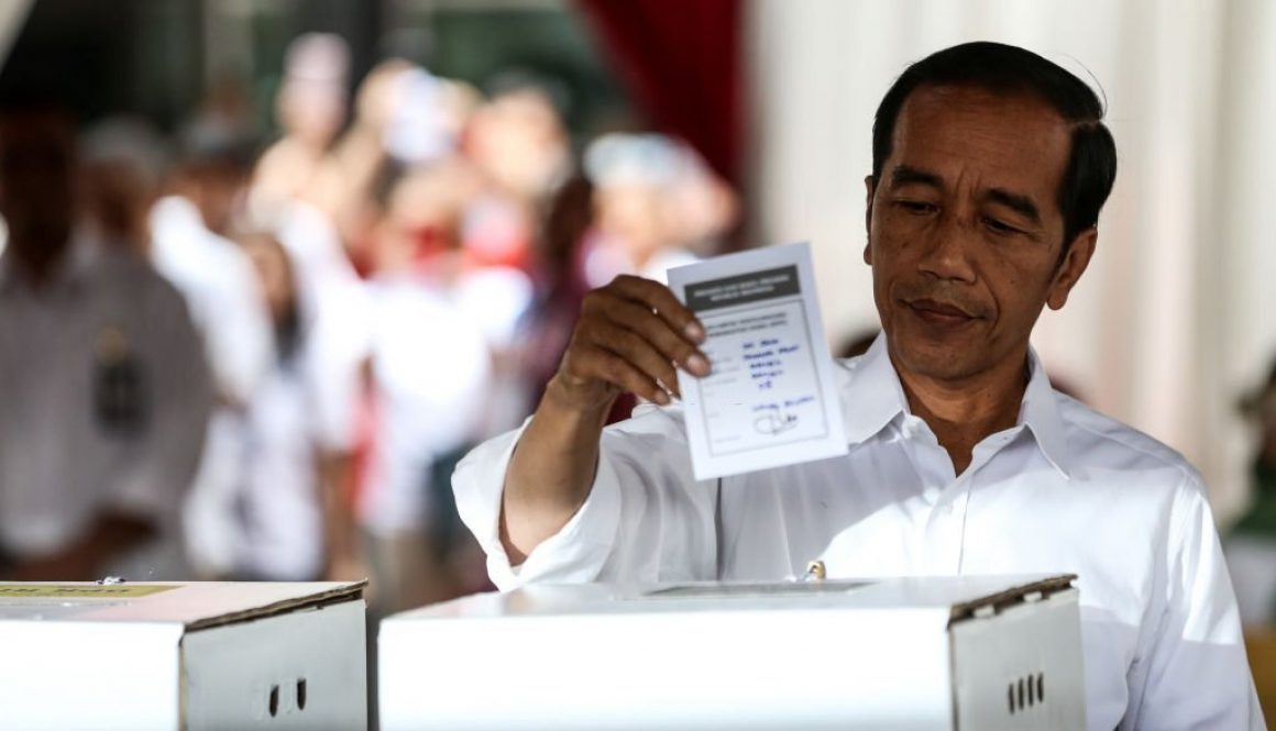 Indonesian President Joko "Jokowi" Widodo give their votes during the election at a polling station in Jakarta, Indonesia on April 17, 2019. Tens of millions of Indonesians were voting in presidential and legislative elections Wednesday after a campaign that pitted the moderate incumbent against an ultranationalist former general whose fear-based rhetoric warned the country would fall apart without his strongman leadership. (Photo by Andrew Gal/NurPhoto via Getty Images)