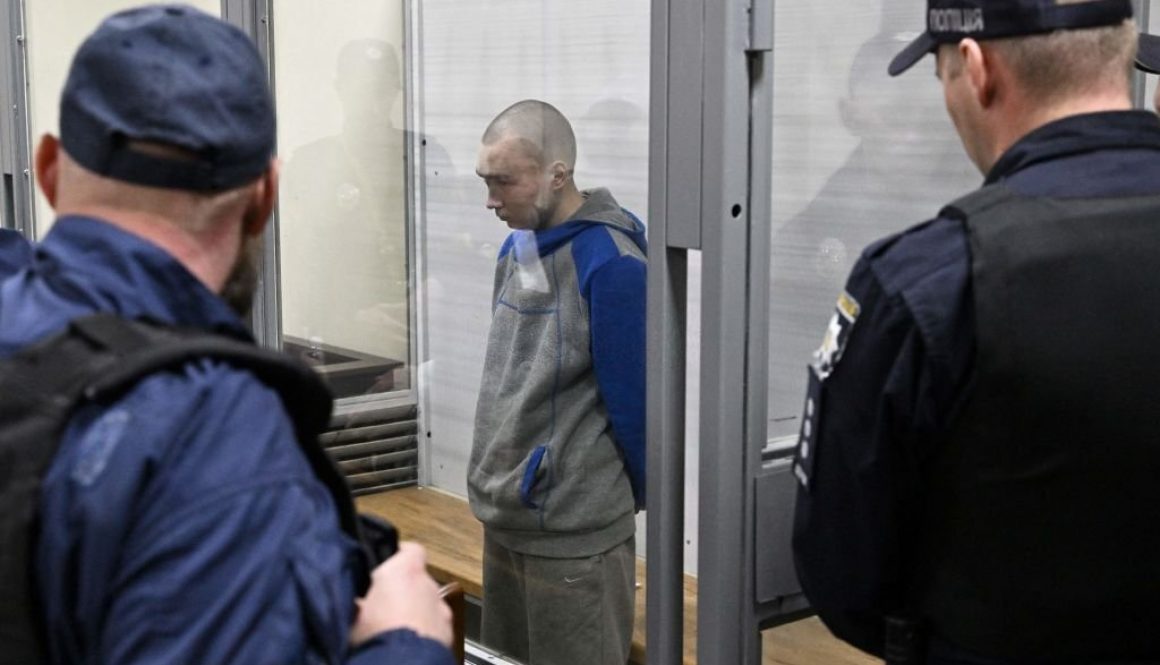 Russian soldier Vadim Shishimarin stands in the defendant's box at the opening of his trial on charge of War crimes for having killed a civilian, in the Solomyansky district court in Kyiv on May 18, 2022. - The captured soldier is accused of killing a 62-year-old civilian -- allegedly on a bicycle -- near the village of Chupakhivka in the northeastern Ukraine Sumy region on February 28, in the first days of the Russian's offensive. Shishimarin pleaded guilty and is facing possible life imprisonment in Kyiv. (Photo by Genya SAVILOV / AFP) (Photo by GENYA SAVILOV/AFP via Getty Images)