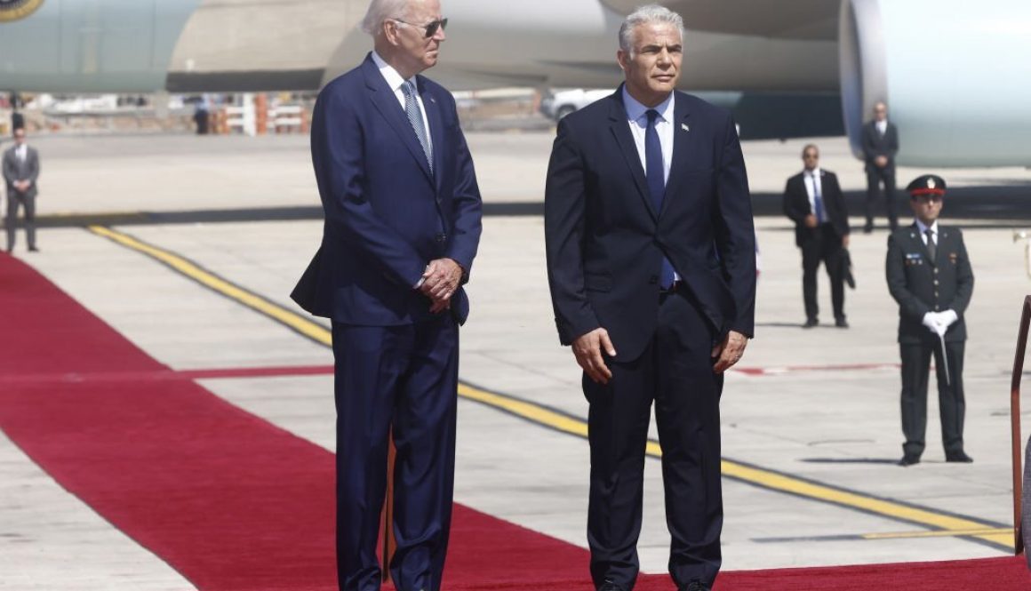 US President Joe Biden, left, and Yair Lapid, Israel's prime minister, during an arrival ceremony at Ben Gurion International Airport in Tel Aviv, Israel, on Wednesday, July 13, 2022. (Photographer: Kobi Wolf/Bloomberg via Getty Images)