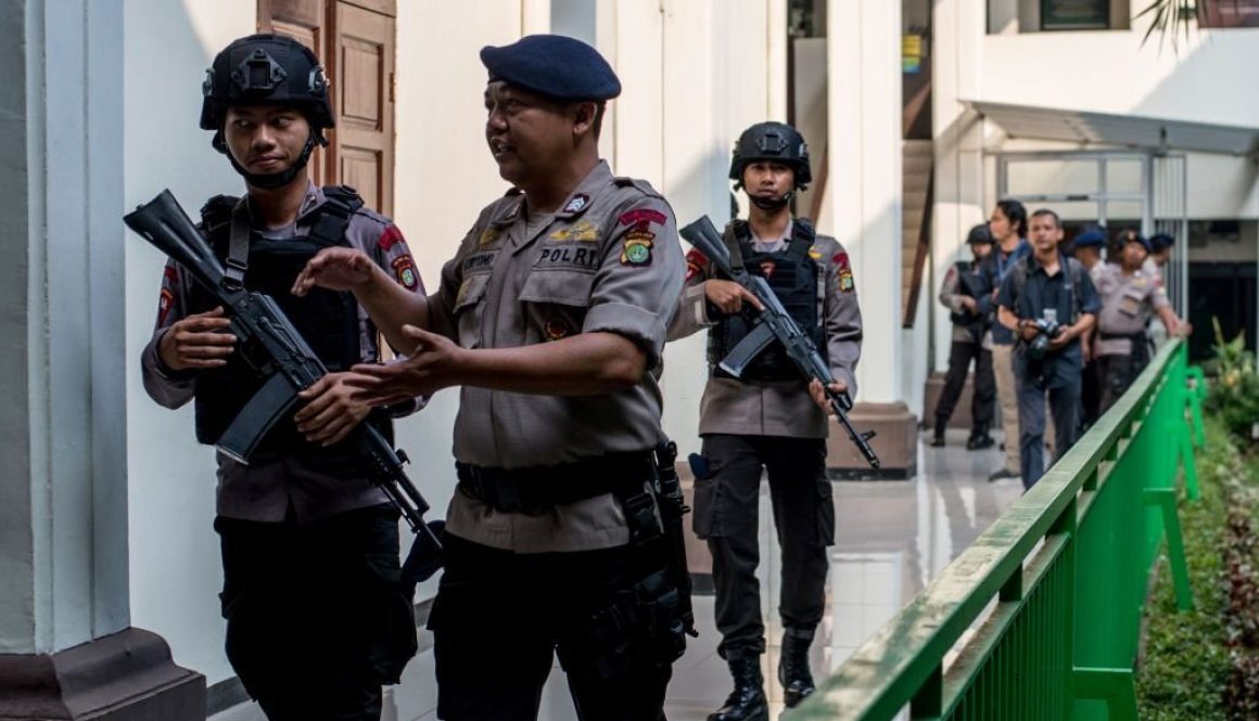 Armed police secure the South Jakarta court before a ruling against radical group Jemaah Ansharut Daulah (JAD) in Jakarta on July 31, 2018. - An Indonesian court banned a local extremist network responsible for a series of deadly terror attacks on home soil, significantly expanding police powers to charge members and freeze funding. (Photo by BAY ISMOYO / AFP) (Photo credit should read BAY ISMOYO/AFP via Getty Images)