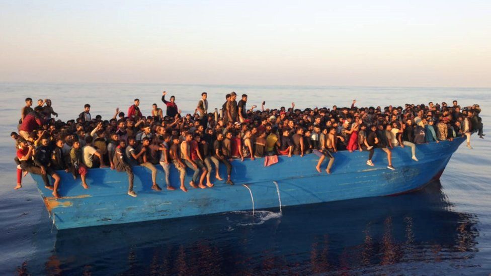 Hundreds of migrants crammed onto a decrepit fishing boat were rescued off the island of Lampedusa, Italy