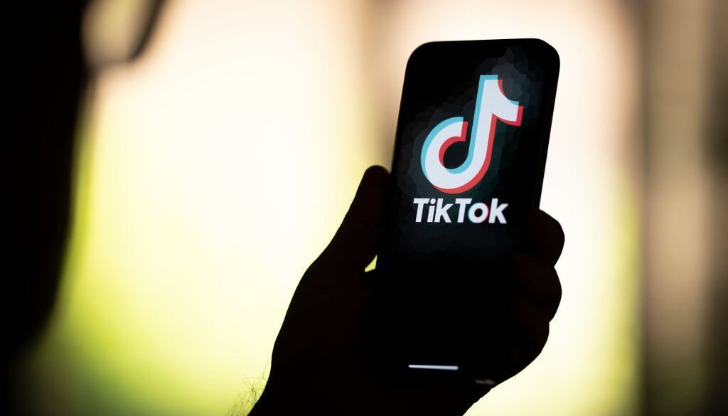 The TikTok logo is seen in this photo illustration on 22 August, 2023 in Warsaw, Poland. (Photo by Jaap Arriens/NurPhoto via Getty Images)