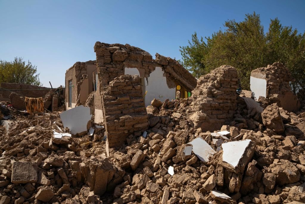 Ruins and rubble from demolished houses are seen in the city of Herat after a massive 6.3 magnitude earthquake, resulting in thousands of injuries and fatalities. (Photo by MUHAMMAD BALABULUKI/Middle East Images/AFP via Getty Images
