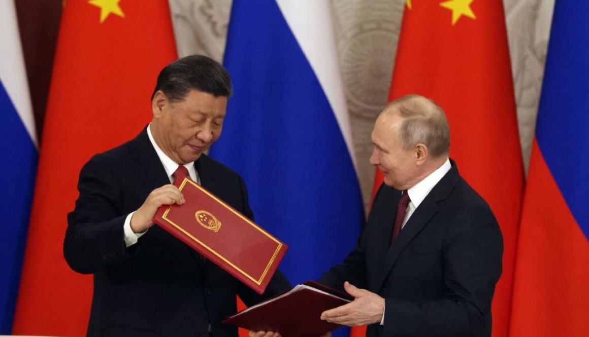 Chinese President Xi Jinping (L) and Russian President Vladimir Putin (R) shake hands during the signing ceremony at the Grand Kremlin Palace, on March 21, 2023 in Moscow, Russia (Photo by Contributor/Getty Images)