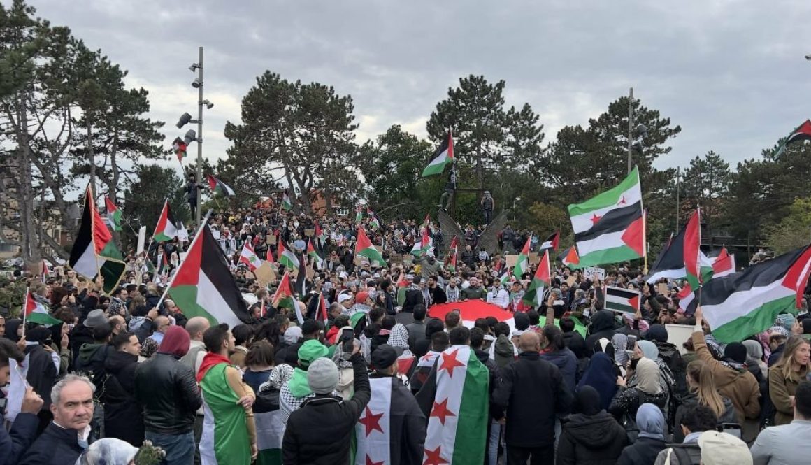 People carrying Palestinian flags and banners gather in front of International Criminal Court (ICC), calling for an investigation for attacks on Gaza, on October 18, 2023 in Hague, Netherlands. (Photo by Abdullah Asiran/Anadolu via Getty Images)