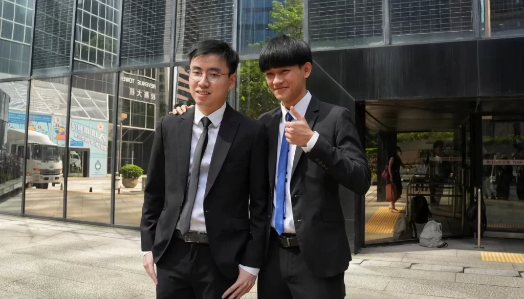 Former University of Hong Kong student leaders Anthony Yung (left) and Chris Todorovski (right) outside Hong Kong’s District Court in Wan Chai on September 20, 2023. Photo: Kyle Lam/HKFP.