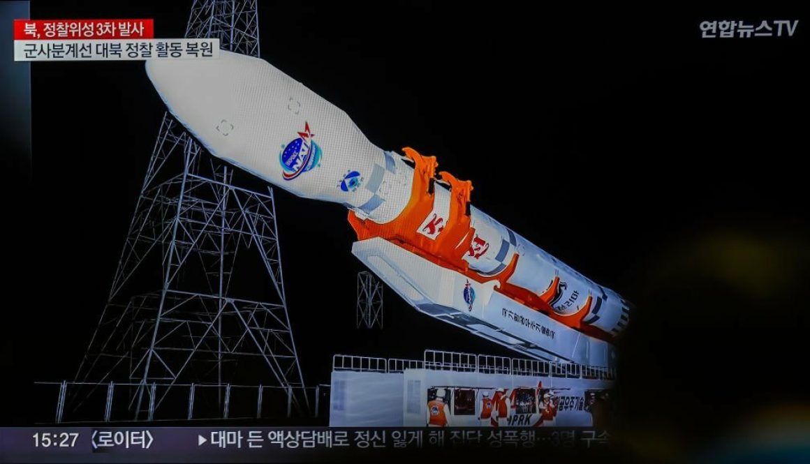 A TV news screen at Seoul's Yongsan Railway Station shows a report that North Korea's reconnaissance satellite, its third attempted launch this year, has entered orbit (Photo by Kim Jae-Hwan/SOPA Images/LightRocket via Getty Images)