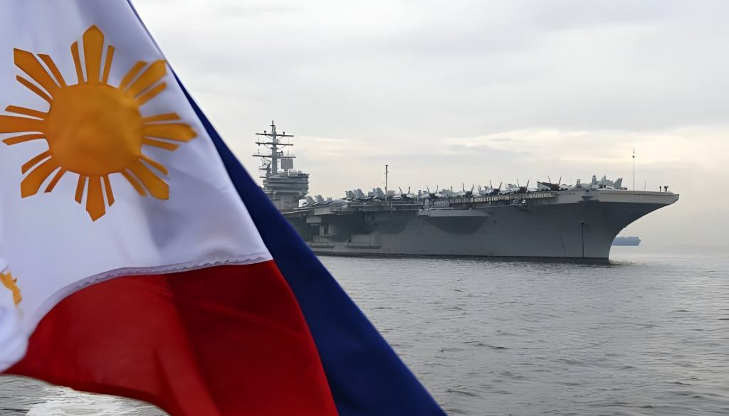 A Philippine flag flutters as the nuclear-powered aircraft carrier USS Ronald Reagan (CVN-76) is seen anchored off Manila bay on June 26, 2018. - A US aircraft carrier visited the Philippines on June 26, the third such call in four months, as its admiral hailed America's "enduring presence" in a region where China's military build-up had raised tensions. (Photo by TED ALJIBE / AFP) (Photo by TED ALJIBE/AFP via Getty Images)