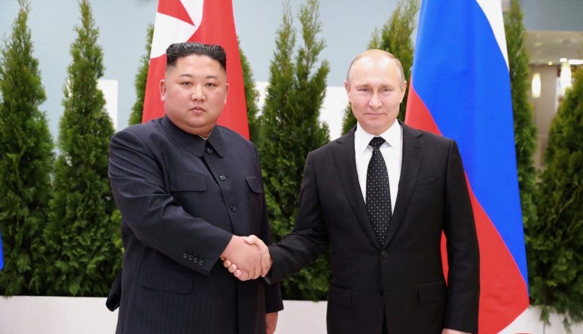 North Korean leader Kim Jong Un shakes hands with Russian President Vladimir Putin in Vladivostok