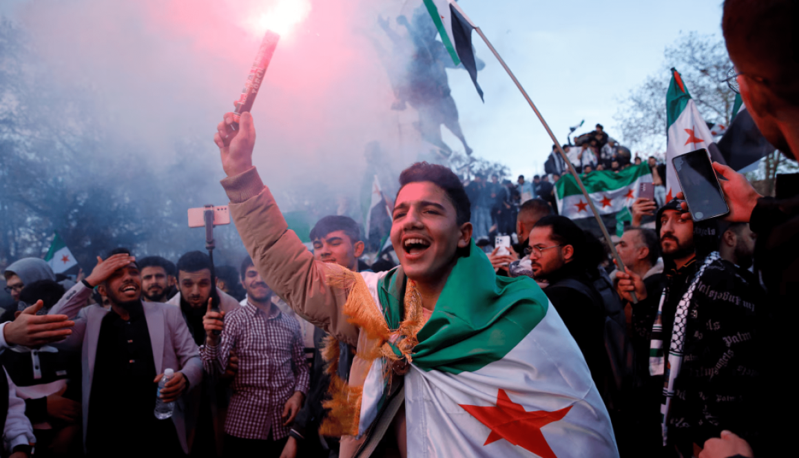 Syrians celebrating the 1 year anniversary of the fall of the Assad regime