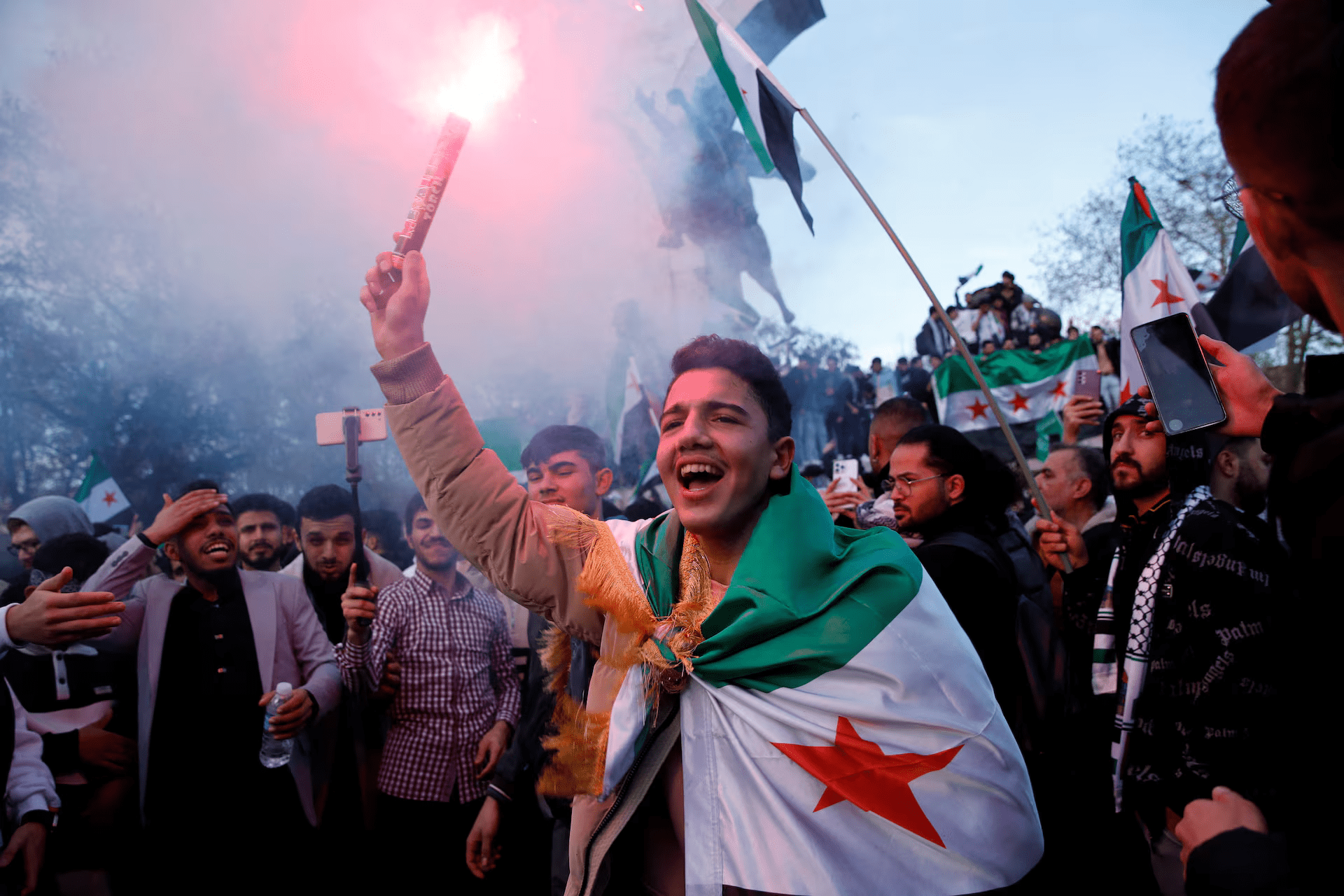 Syrians celebrating the 1 year anniversary of the fall of the Assad regime