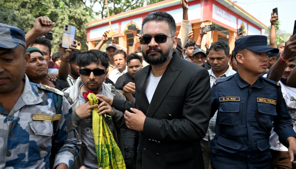 Rastriya Swatantra Party election candidate Balendra Shah, center, is greeted by supporters during a rally on the final day of campaigning, in Gauriganj, Nepal on Tuesday