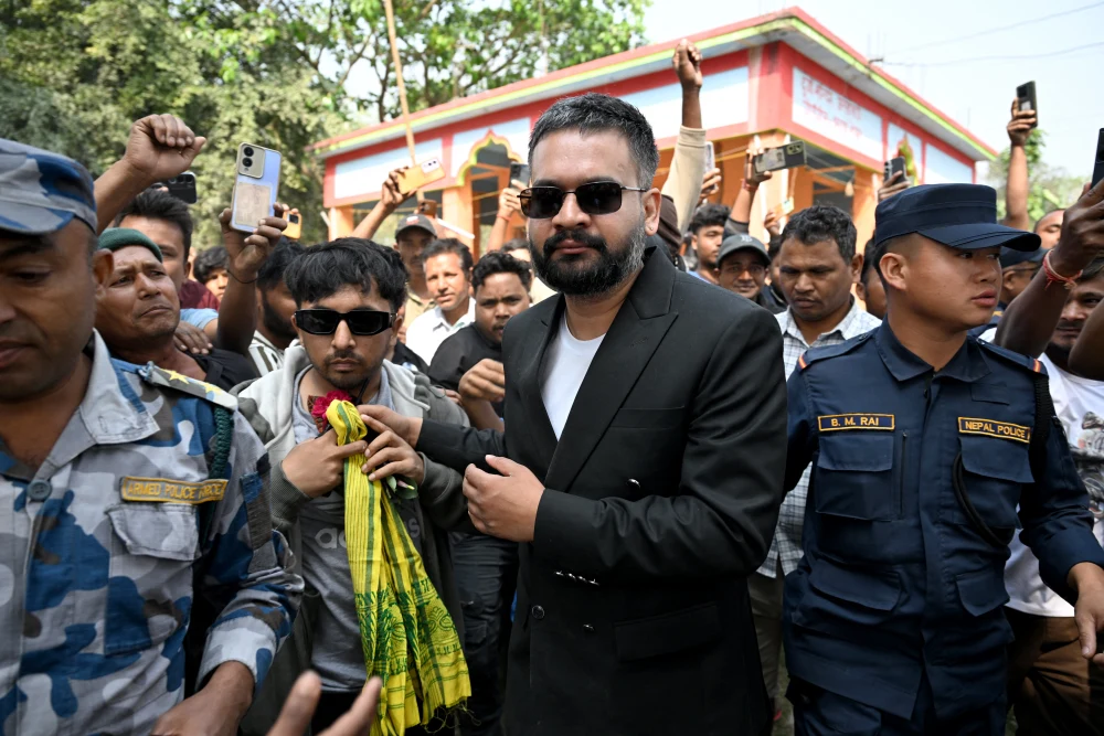 Rastriya Swatantra Party election candidate Balendra Shah, center, is greeted by supporters during a rally on the final day of campaigning, in Gauriganj, Nepal on Tuesday