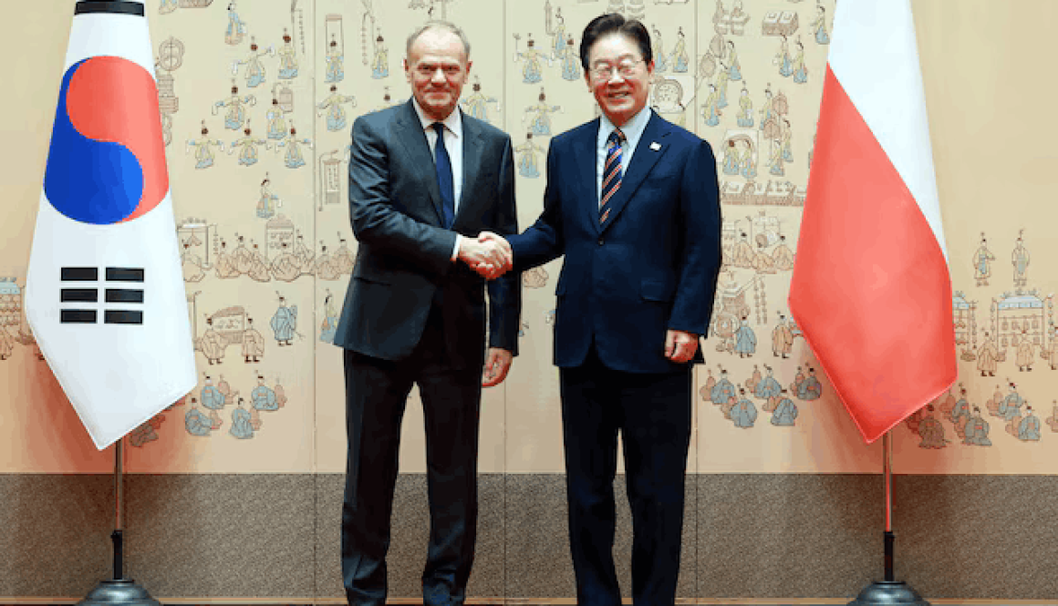 Polish Prime Minister Donald Tusk and South Korean President Lee Jae Myung pose for photographs before their meeting at the Presidential Blue House in Seoul, South Korea, April 13, 2026.